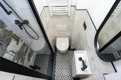 a bathroom with a shower and a toilet and a sink at Krakow Old Town Apartments in Kraków