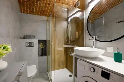 a bathroom with a sink and a toilet and a shower at Unique studio perfect for couples, Old Podgórze in Kraków