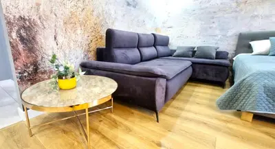 a living room with a couch and a table at LUXURY BLUE CASCADE studio DOWNTOWN balcony in Kraków