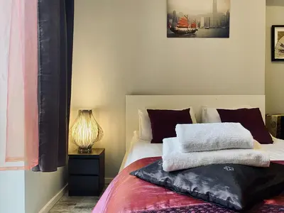 a bedroom with a bed with two towels on it at Apartment next to Wawel Castle, Vistula River & Old Town Cracow in Kraków