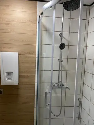 a shower in a bathroom with a glass shower stall at Lawendowy Domek TP in Sułkowice