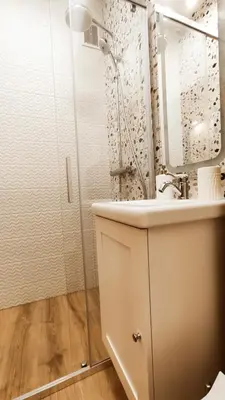a bathroom with a sink and a mirror and a shower at Daszyńskiego 18 by Homeprime in Kraków