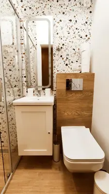 a bathroom with a toilet and a sink and a mirror at Daszyńskiego 18 by Homeprime in Kraków