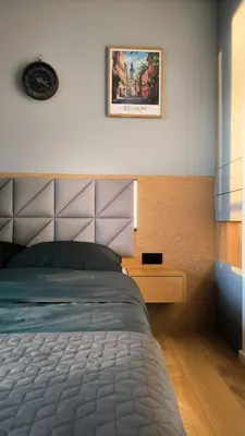 a bedroom with a bed and a picture on the wall at Mogilska Tauron Arena Two Bedroom Apartment in Kraków