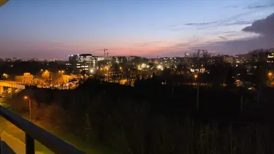a view of a city at night with lights at Mogilska Tauron Arena Two Bedroom Apartment in Kraków