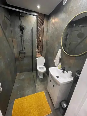 a bathroom with a shower and a toilet and a sink at Leśne Zacisze Iwkowa in Iwkowa