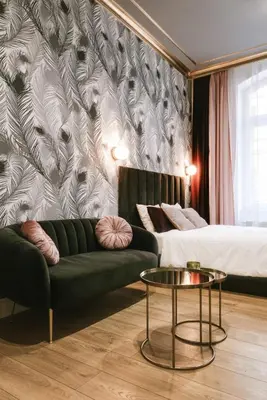 a living room with a couch and a bed and a table at Old Town Krakow in Kraków