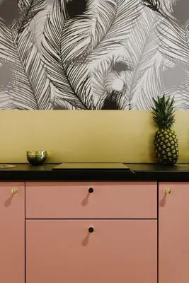 a pink dresser with a pineapple on top of it at Old Town Krakow in Kraków