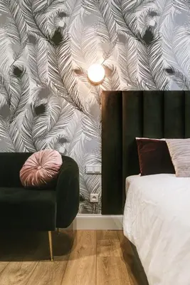 a bedroom with a bed and a couch and a wall at Old Town Krakow in Kraków