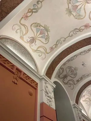 a room with a ceiling with flowers on it at Starowiślna Center Apartments in Kraków