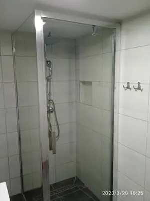 a shower with a glass door in a bathroom at Dwa Widoki Apartamenty in Zubrzyca Górna