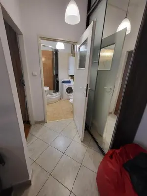 a bathroom with a toilet and a mirror at Apartament on Kazimierz in Kraków