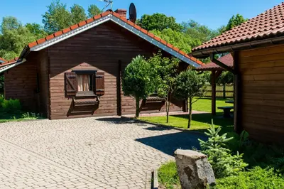 a small building with a window and a patio at Noclegi-Dobczyce in Dobczyce