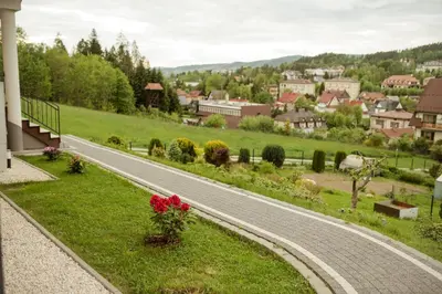 a winding road in the middle of a village at Apartament Słoneczna Rapsodia - blisko Parku Zdrojowego - piękny widok - ogród - taras in Rabka