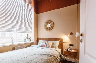 a bedroom with a bed and a window at Old Town Apartment Kraków in Kraków