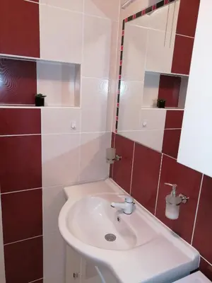 a bathroom with a sink and a mirror at Apartament Skawina in Skawina