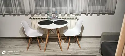 a table and two chairs in a living room at Apartament Skawina in Skawina