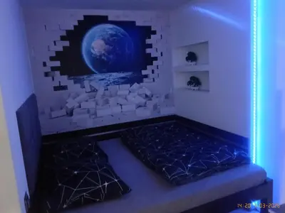 a purple room with a bed in a brick wall at Apartament Skawina in Skawina