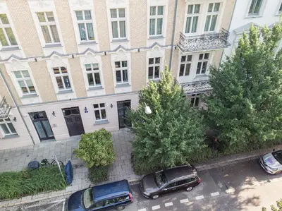 an aerial view of cars parked in front of a building at Cozy Apartment in Old Town in Kraków