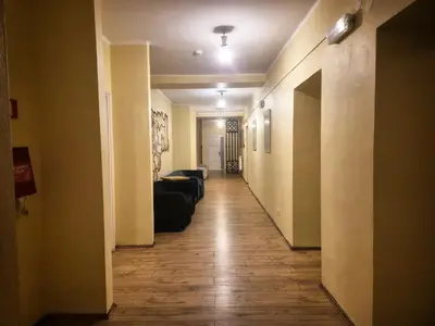 a long hallway with a couch and a living room at 50 People Bis Apartment in Kraków