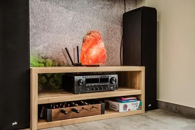 a book shelf with a radio and a speaker at KROSNA92 in Krosna