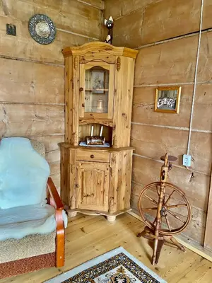 two beds in a room with a window at Góralska chata z 1930r. in Obidowa
