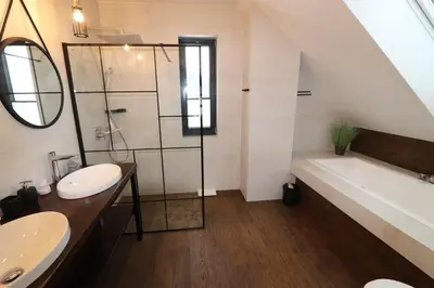 a bathroom with a sink and a bath tub and a bath tub at Domy Pod Babią in Zawoja