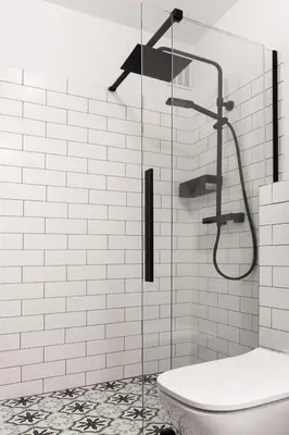 a bathroom with a glass shower with a toilet at Studio Kolberga Kraków in Kraków