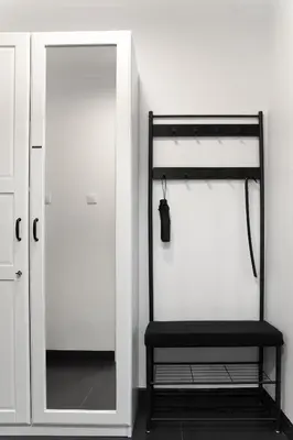 a black bunk bed in a room with a mirror at Studio Kolberga Kraków in Kraków