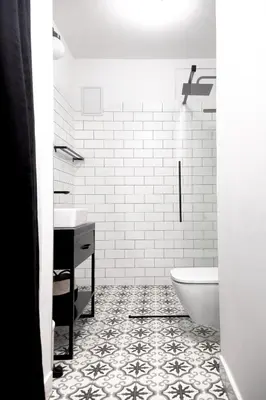 a white bathroom with a toilet and a sink at Studio Kolberga Kraków in Kraków