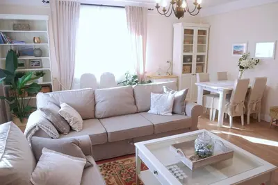 a living room with a couch and a table at ZENDA - Przytulny apartament w zacisznym miejscu in Wieprz