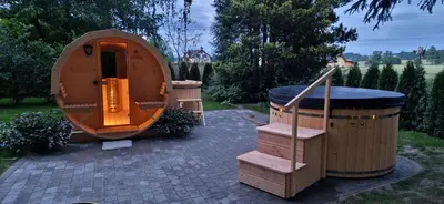 a sauna and a hot tub in a backyard at ZENDA - Przytulny apartament w zacisznym miejscu in Wieprz