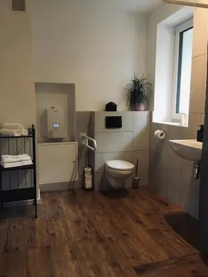 a bathroom with a toilet and a sink at DOMEK U MARKA Zator in Przeciszów