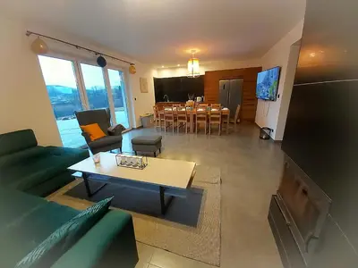 a living room with a couch and a table at Sarnie wzgórze Sucha Beskidzka sauna jacuzzi in Kuków