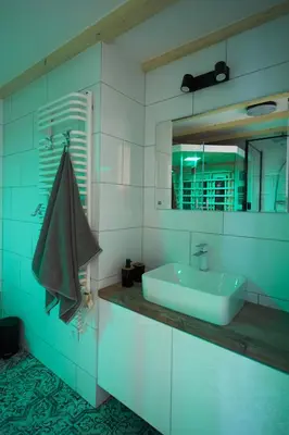 a bathroom with a sink and a mirror at Stylish Apartment Kraków - Old Town in Kraków