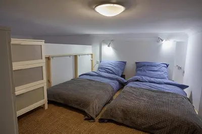 two beds sitting next to each other in a room at Stylish Apartment Kraków - Old Town in Kraków