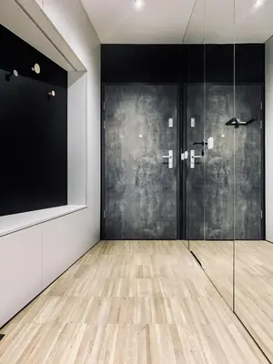 a room with a glass door and a television at Apartment next to Cracow Eye, Vistula Boulevards in Kraków