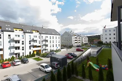 a view from a balcony of a parking lot at Lenzo Apartments Wieliczka in Wieliczka