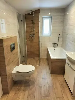 a bathroom with a toilet and a shower and a sink at Zielony Zakątek in Złota