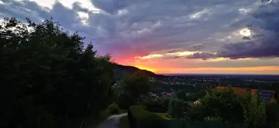 a sunset on a hill with a road at JAWORNICA HOUSE domek z pięknym widokiem in Targanice