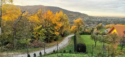 a winding road through a village in the fall at JAWORNICA HOUSE domek z pięknym widokiem in Targanice