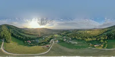 an aerial view of a valley with the sun setting at JAWORNICA HOUSE domek z pięknym widokiem in Targanice