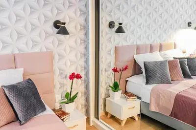 a bedroom with two beds and a mirror at Cracowapart Ignacio A in Kraków