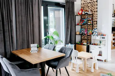 a dining room with a table and chairs at RABA RESORT - Domki i Apartamenty pod Krakowem in Gdów
