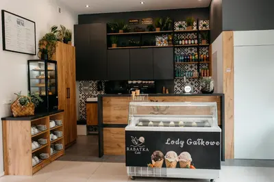 a bakery with a display case in a store at RABA RESORT - Domki i Apartamenty pod Krakowem in Gdów