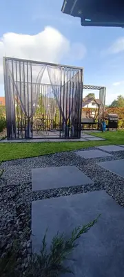 a playground in a park with a swing at Apartamenty Obidowa in Obidowa