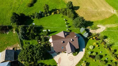 an overhead view of a house in a field at Beskid Rose & SPA in Słopnice