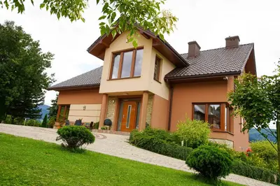 a house with a pathway in front of it at Beskid Rose & SPA in Słopnice
