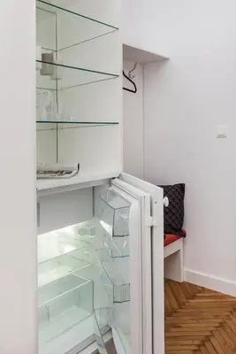 a refrigerator with clear glass shelves in a kitchen at Luxury SPA Apartment Old Town Krakow in Kraków