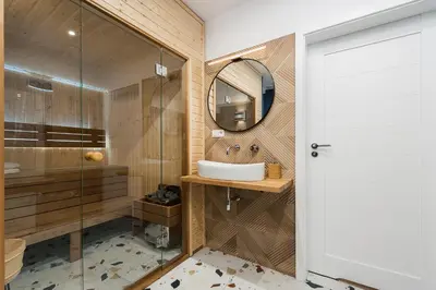 a bathroom with a sink and a mirror at Luxury SPA Apartment Old Town Krakow in Kraków